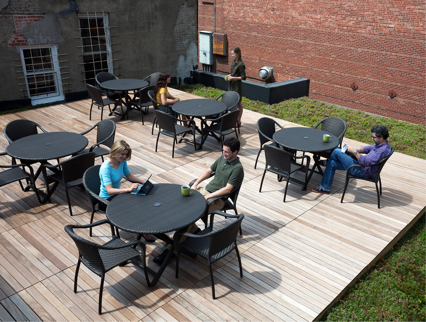 employees having a meeting on a green roof