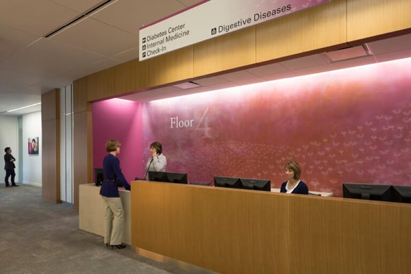 hospital workers at a reception desk