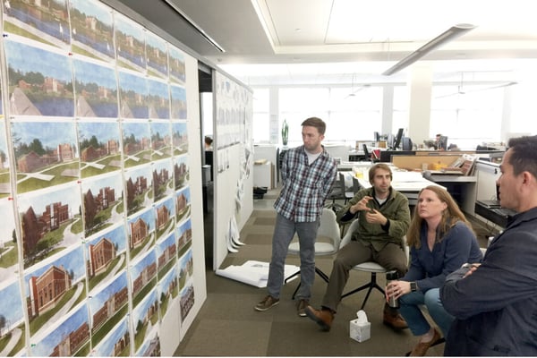 group of architects reviewing plans
