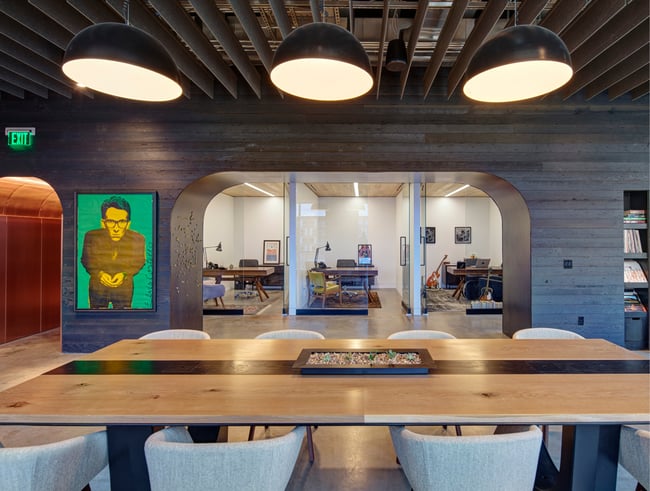 a contemporary office with colorful art piece depicting Elvis Costello