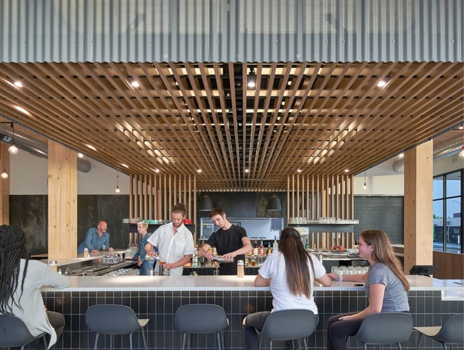 restaurant space with wood ceiling panels