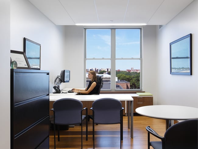 employee working at a desk in a private office