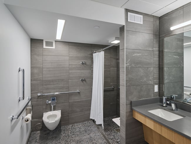 a restroom at the Stanley Center with an accessible shower and sink